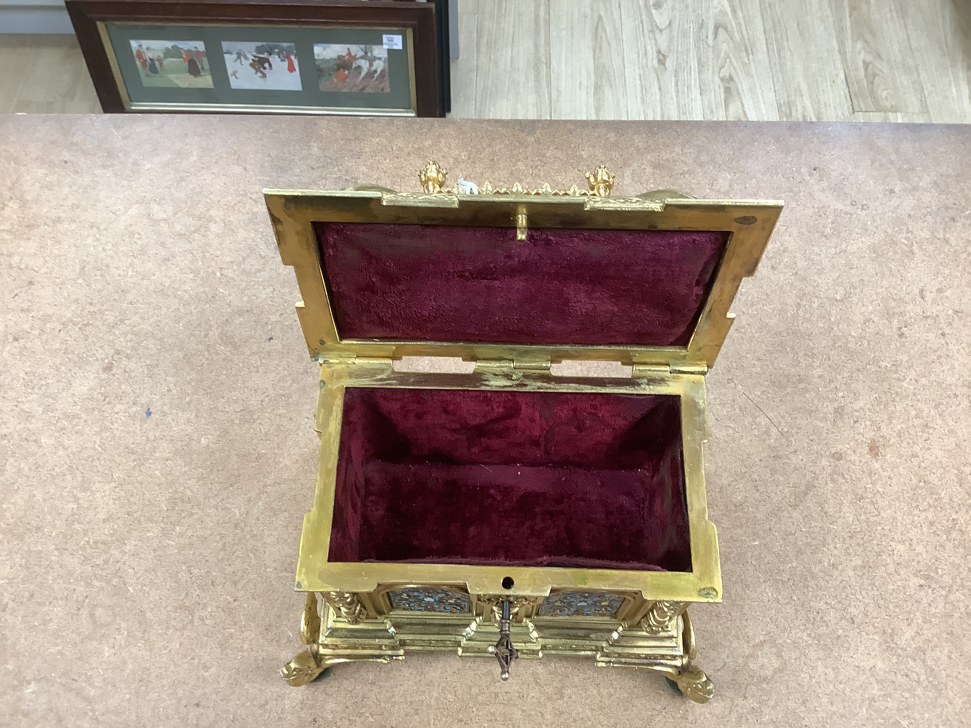 A cast brass and enamel casket 22cm high x 22cm wide